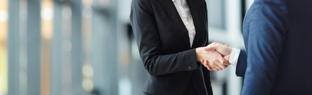two business men shaking each others hand